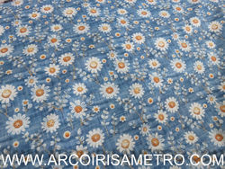 DAISY ON DENIM BACKGROUND