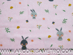 PRINTED FLANNEL WITH BUNNIES ON A PINK BACKGROUND