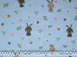 PRINTED FLANNEL WITH BUNNIES ON A BLUE BACKGROUND